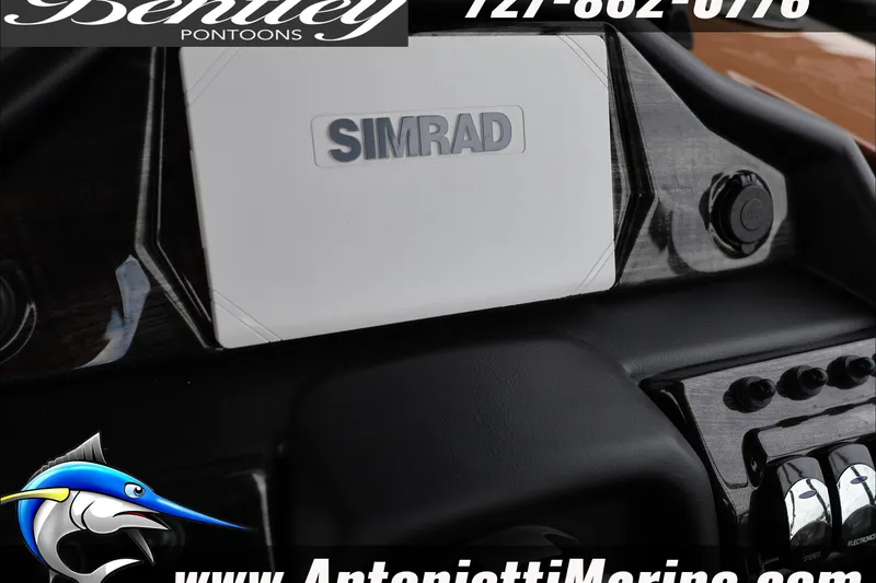 Slide: The Image of Dashboard of 2026 Bentley Pontoons Elite 223 with Simrad display and controls. - 21