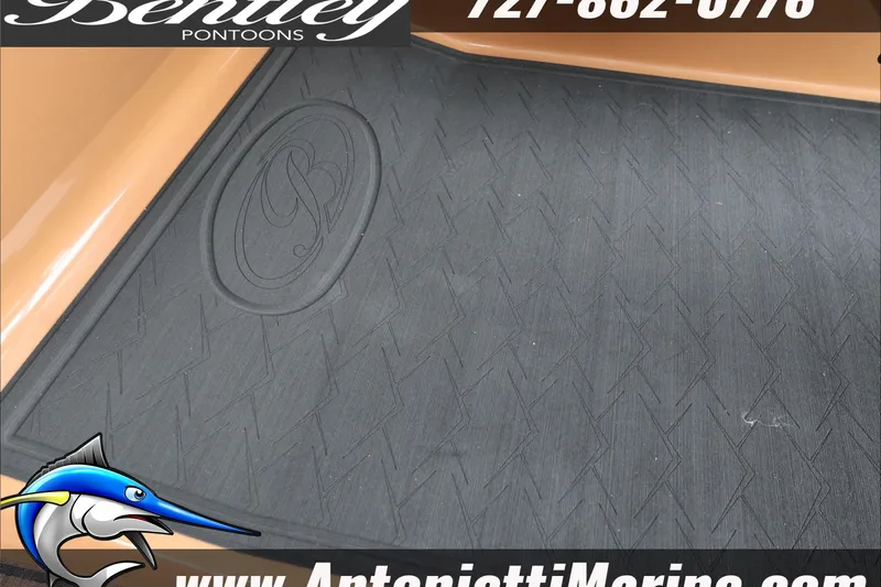 Slide: The Image of 2026 Bentley Pontoons Elite 223 Swingback Dual Captains floor mat with logo and contact details. - 27
