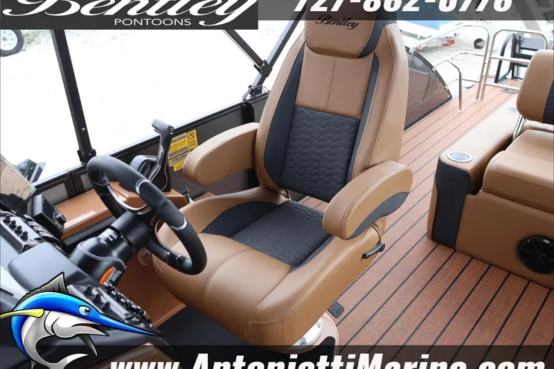 Slide: The Image of 2026 Bentley Pontoons Elite 223 Swingback Dual Captains chair and helm, luxury interior design. - 29