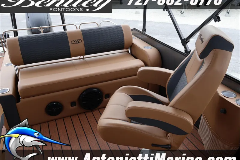 Slide: The Image of 2026 Bentley Pontoons Elite 223 Swingback interior with luxurious seating and cup holders. - 30