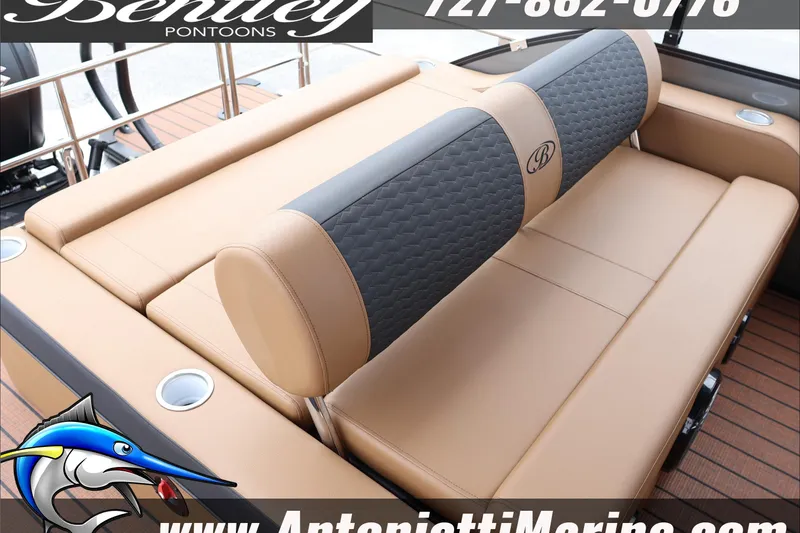 Slide: The Image of 2026 Bentley Pontoons Elite 223 Swingback Dual Captains seat, luxurious tan and gray upholstery. - 32