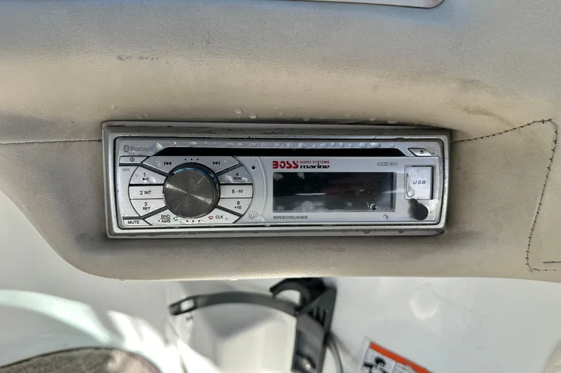 Slide: The Image of Hand holding trailer hitch wiring for 1997 Cobalt 190 on asphalt surface. - 15