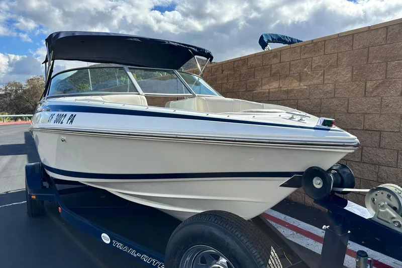 Slide: The Image of 1997 Cobalt 190 boat dashboard with steering wheel and instrument panel. - 9