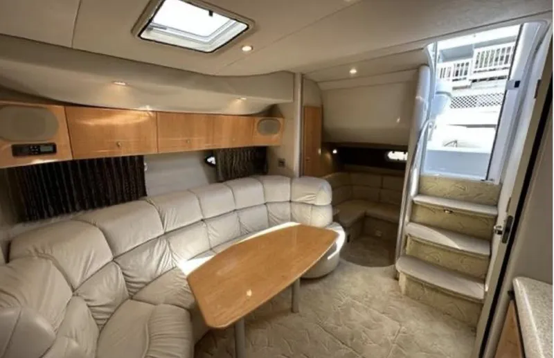 Slide: The Image of Luxurious interior of a 2003 Formula 37 PC yacht with plush seating and wooden accents. - 19