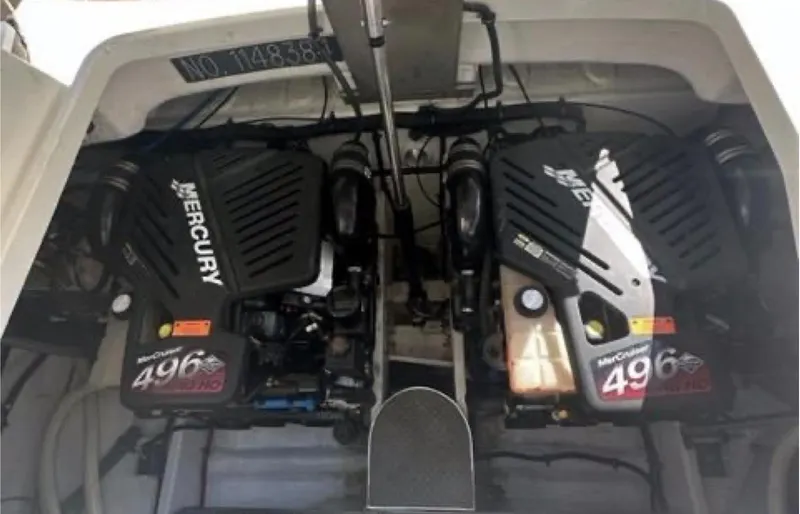 Slide: The Image of Twin Mercury engines in a 2003 Formula 37 PC boat engine compartment. - 25