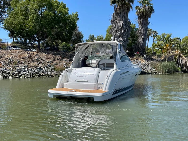 Slide: The Image of 2003 Formula 37 PC yacht cruising on a calm river with lush greenery. - 3