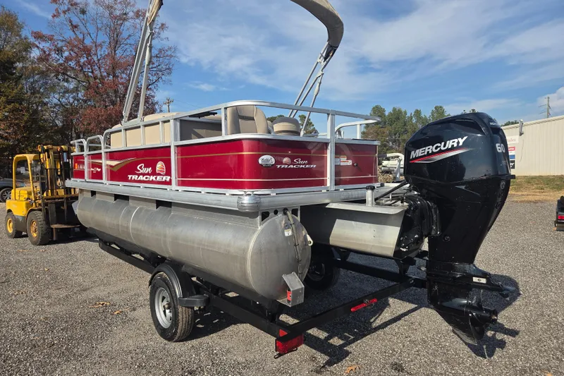 Slide: The Image of 2021 Sun Tracker Bass Buggy 18 DLX pontoon boat with Mercury engine on trailer. - 5