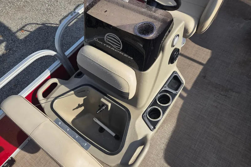 Slide: The Image of 2021 Sun Tracker Bass Buggy 18 DLX boat interior with seating and cup holders. - 7
