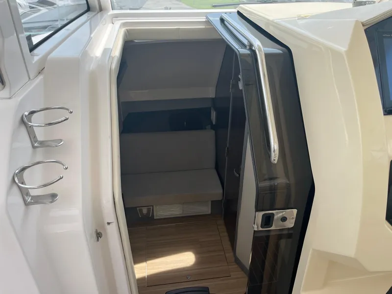 Slide: The Image of 2019 Regal 33 SAV cabin entrance with sleek interior and modern design. - 26