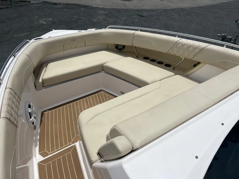 Slide: The Image of Luxurious seating area on a 2019 Regal 33 SAV boat with beige cushions. - 29