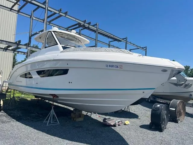 Slide: The Image of 2019 Regal 33 SAV boat on stands in a storage yard. - 9
