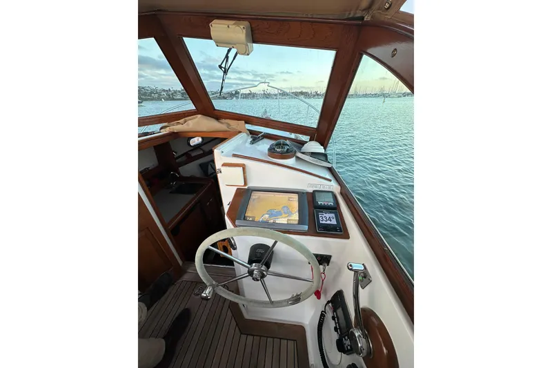 Slide: The Image of Interior view of 2008 Wasque 26 boat cockpit with navigation equipment. - 2