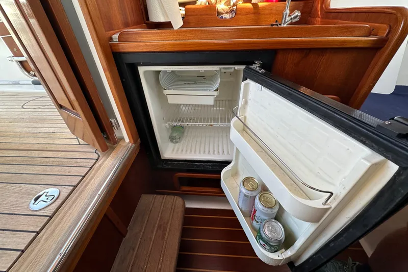 Slide: The Image of Open fridge on a 2008 Wasque 26 boat. - 28