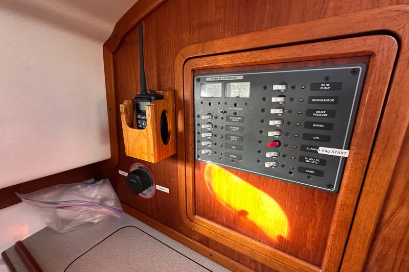 Slide: The Image of Electrical panel and radio on a 2008 Wasque 26 boat interior. - 32