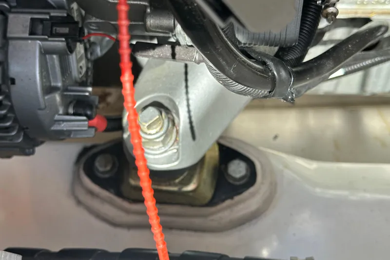 Slide: The Image of Engine compartment detail of a 2008 Wasque 26 boat, showing mechanical components and wiring. - 46