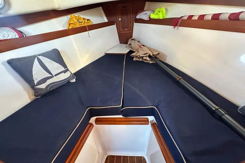 Slide: The Image of Interior cabin of a 2008 Wasque 26 boat with nautical decor. - 8