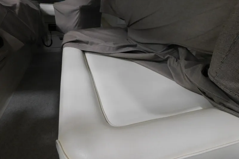 Slide: The Image of 1999 Sea Ray 500 Sundancer interior with covered seating area. - 10