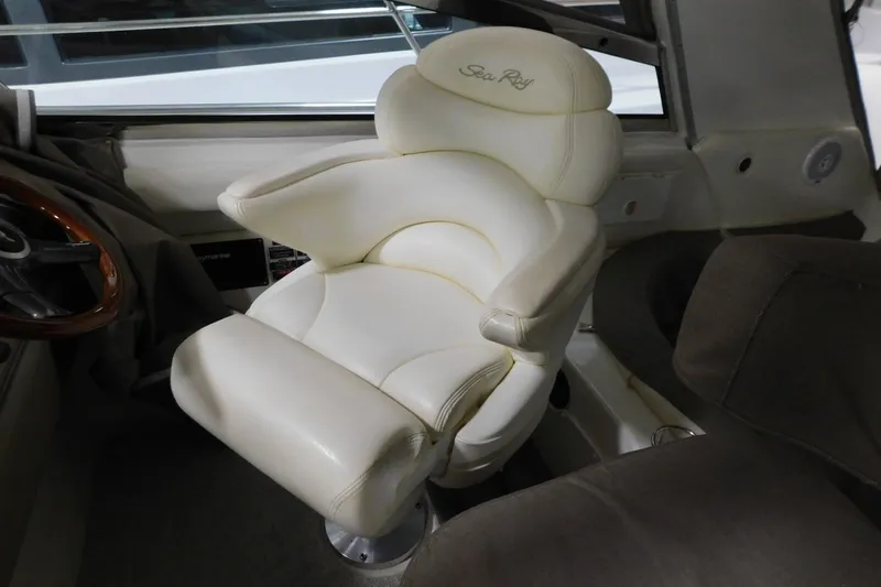 Slide: The Image of Luxurious captain's chair in 1999 Sea Ray 500 Sundancer yacht cockpit. - 11