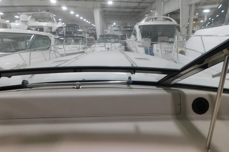 Slide: The Image of 1999 Sea Ray 500 Sundancer yacht interior view in a marina showroom. - 17