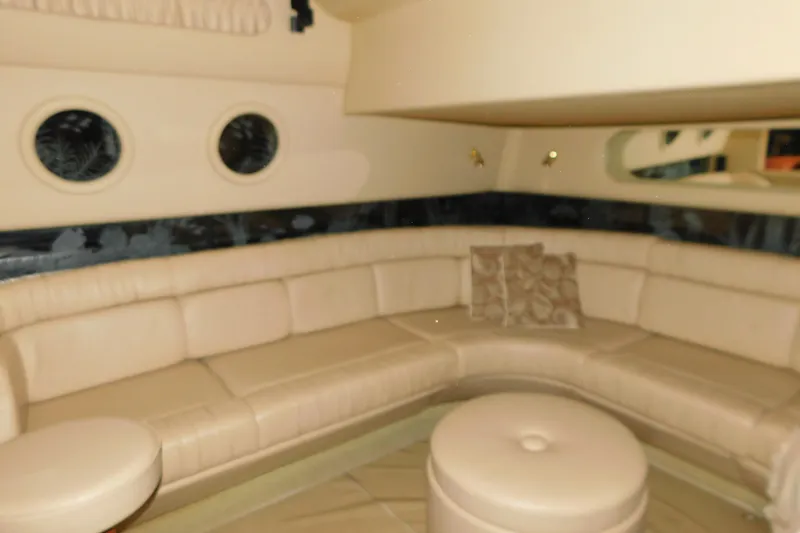 Slide: The Image of Luxurious interior of 1999 Sea Ray 500 Sundancer yacht with beige leather seating. - 19