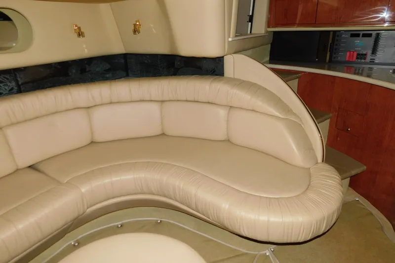 Slide: The Image of Luxurious interior of 1999 Sea Ray 500 Sundancer yacht with beige leather seating. - 20