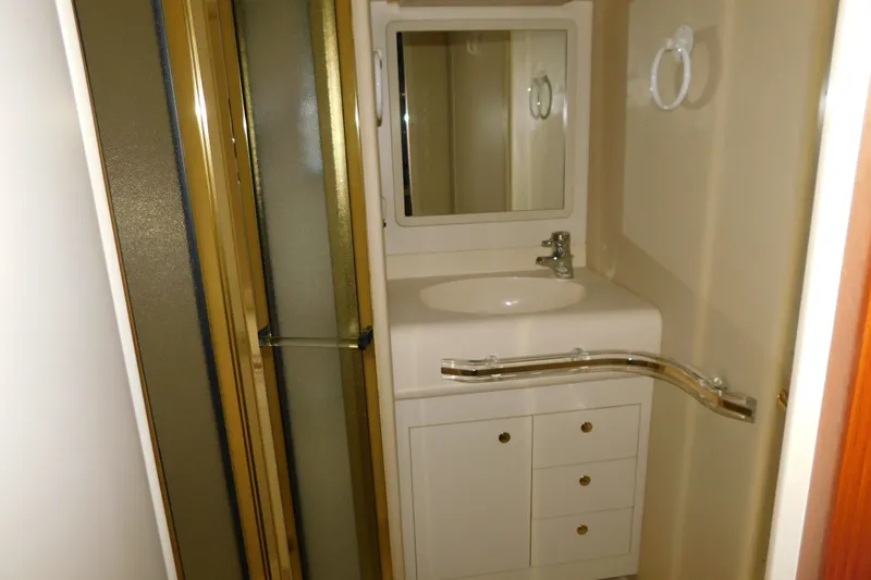 Slide: The Image of Bathroom interior of 1999 Sea Ray 500 Sundancer yacht with sink and shower. - 23