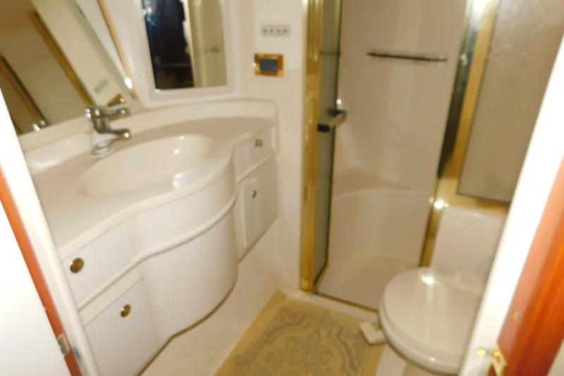 Slide: The Image of Bathroom interior of 1999 Sea Ray 500 Sundancer yacht, featuring sink and shower. - 29