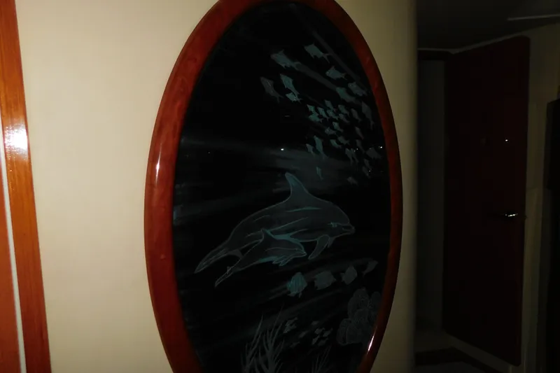 Slide: The Image of Etched glass artwork featuring dolphins and fish on a 1999 Sea Ray 500 Sundancer yacht. - 31