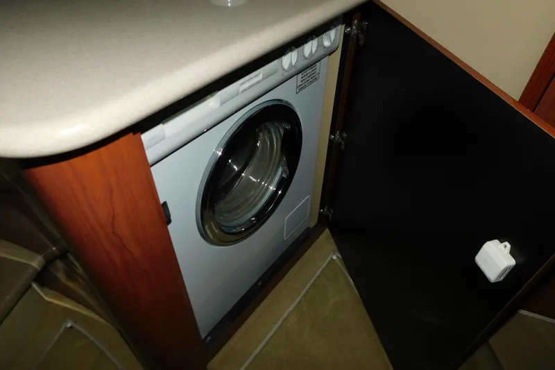 Slide: The Image of Washing machine inside 1999 Sea Ray 500 Sundancer yacht cabinet. - 32
