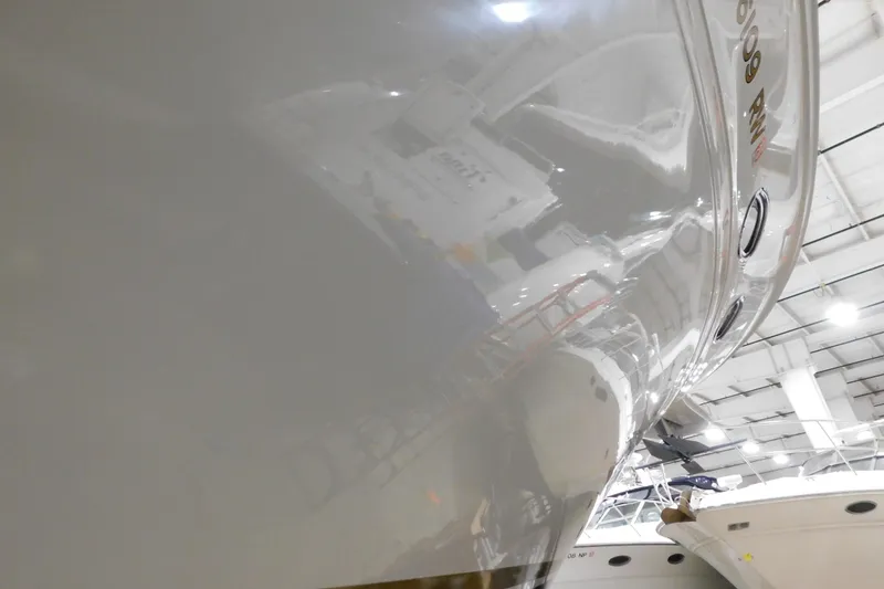 Slide: The Image of 1999 Sea Ray 500 Sundancer yacht in a well-lit indoor storage facility. - 39