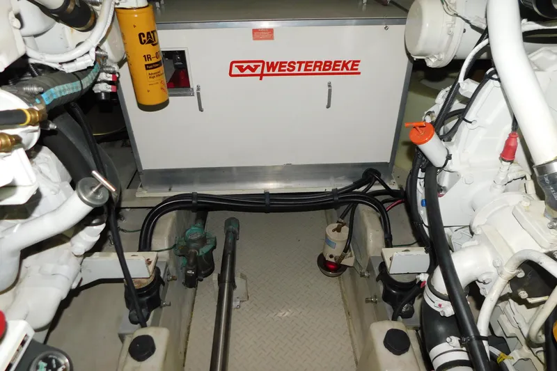 Slide: The Image of Engine room of 1999 Sea Ray 500 Sundancer with Westerbeke generator and CAT filter. - 42