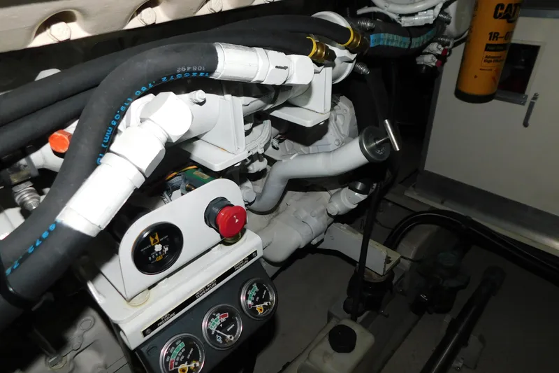 Slide: The Image of Engine compartment of a 1999 Sea Ray 500 Sundancer with gauges and hoses visible. - 43