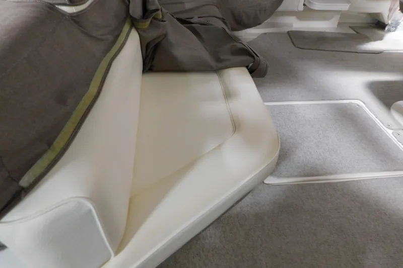 Slide: The Image of Interior seating of a 1999 Sea Ray 500 Sundancer yacht with gray carpet. - 8