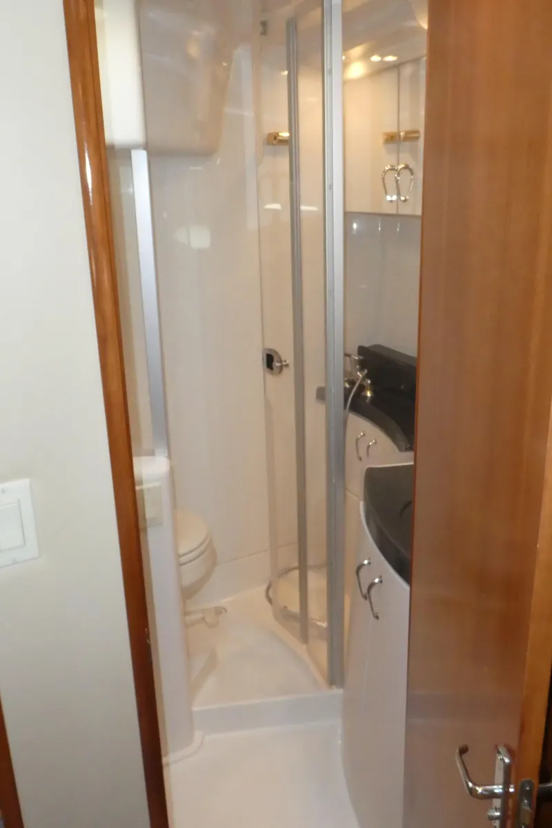 Slide: The Image of 2005 Carver 38 Super Sport yacht bathroom with shower and vanity. - 19