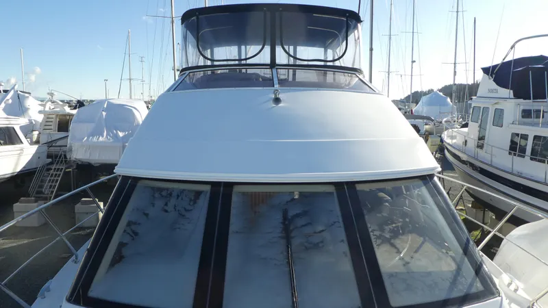 Slide: The Image of 2005 Carver 38 Super Sport yacht docked at marina, front view. - 25