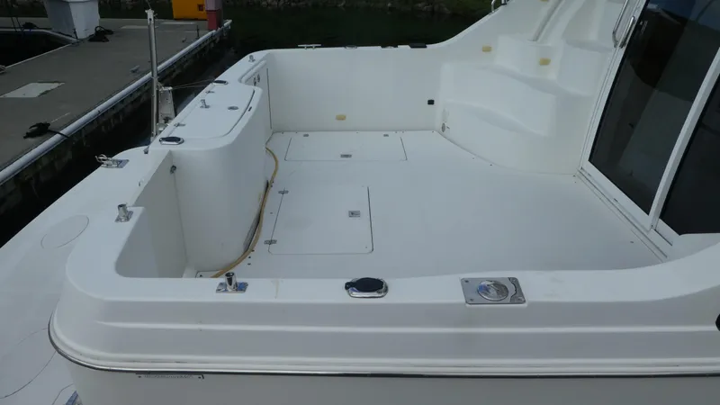 Slide: The Image of 2005 Carver 38 Super Sport boat deck, spacious and clean design. - 3