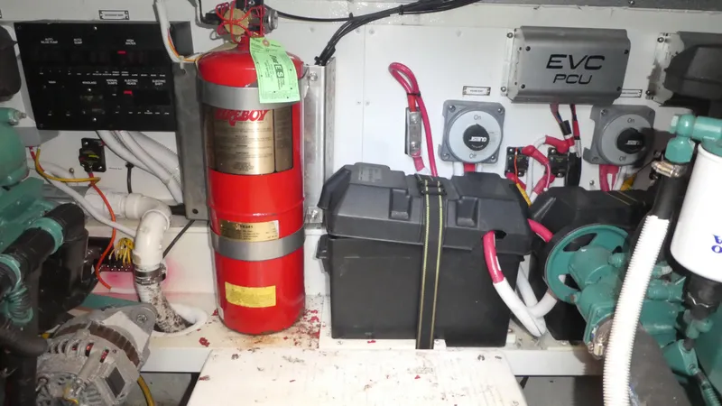 Slide: The Image of Engine room of 2005 Carver 38 Super Sport with fire extinguisher and electrical components. - 36