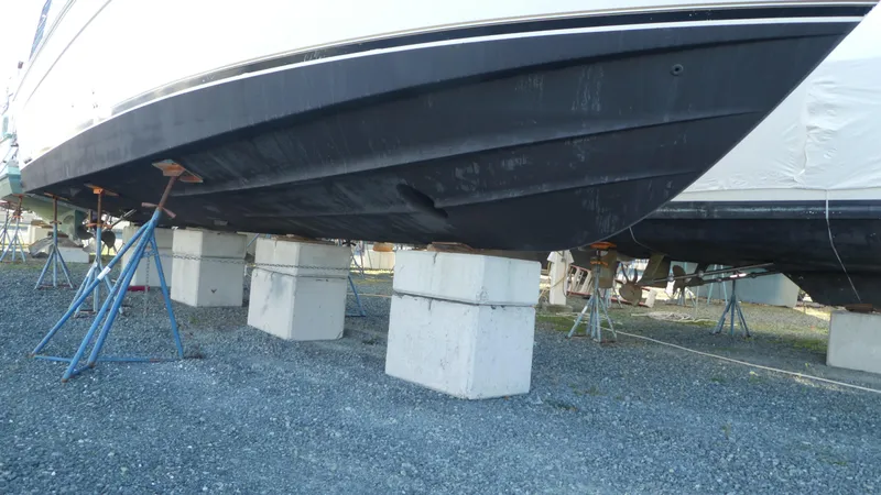 Slide: The Image of 2005 Carver 38 Super Sport boat on blocks, under maintenance. - 44