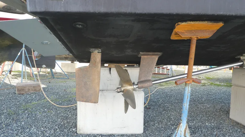 Slide: The Image of 2005 Carver 38 Super Sport boat propeller and rudder on dry dock. - 45
