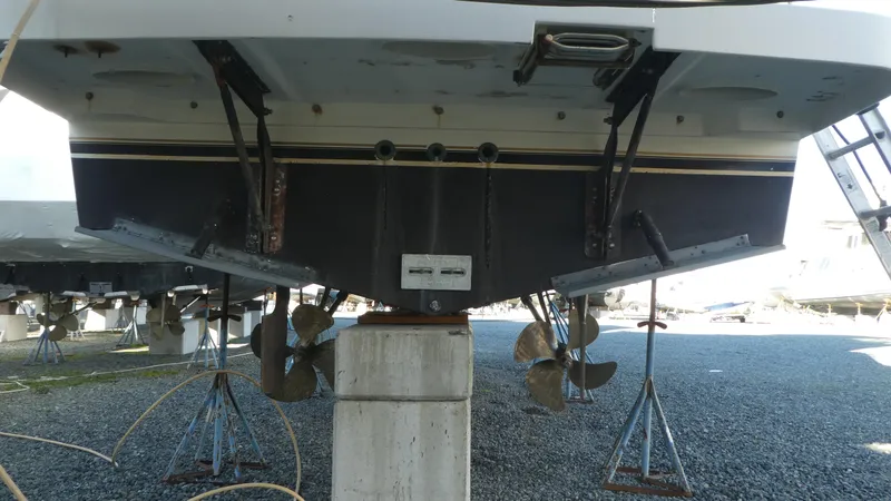 Slide: The Image of 2005 Carver 38 Super Sport boat hull and propellers on stands. - 46