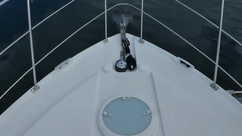 Slide: The Image of 2005 Carver 38 Super Sport boat bow with anchor and hatch. - 48