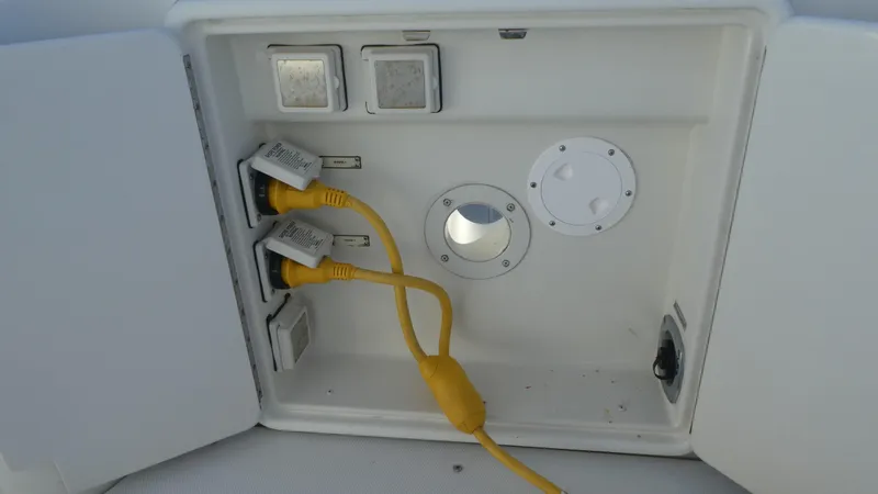 Slide: The Image of Electrical panel with yellow cables on 2005 Carver 38 Super Sport boat. - 32