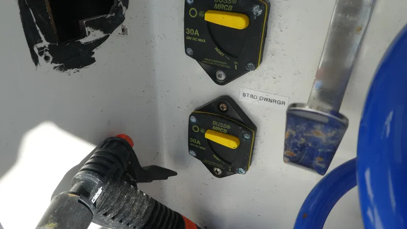 Slide: The Image of Close-up of 2005 Carver 38 Super Sport boat electrical panel with circuit breakers. - 33
