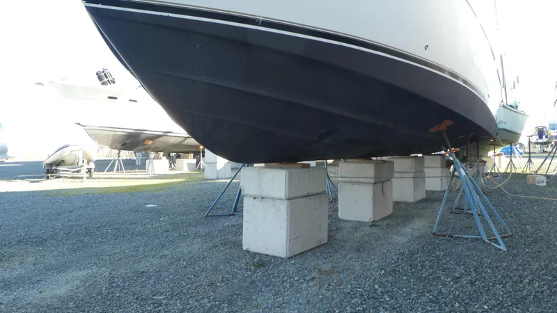 Slide: The Image of 2005 Carver 38 Super Sport yacht on blocks in a boatyard. - 42
