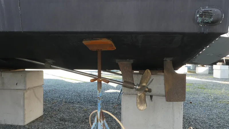 Slide: The Image of 2005 Carver 38 Super Sport boat propeller and rudder on dry dock. - 43