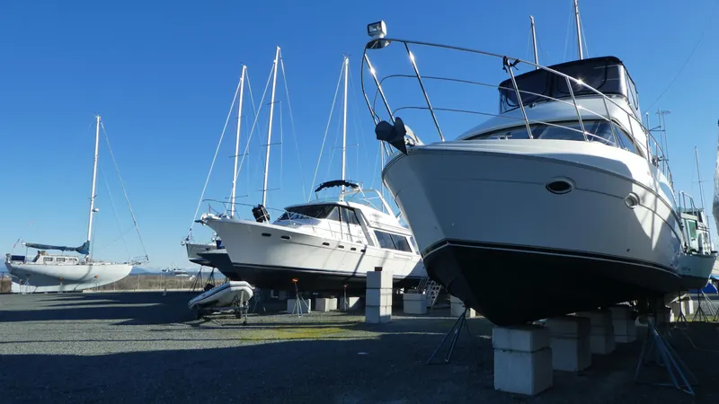 Slide: The Image of 2005 Carver 38 Super Sport yacht on dry dock with other boats. - 49