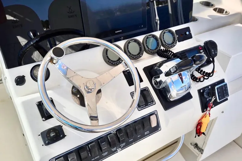 Slide: The Image of Steering console of a 2003 Pursuit 3070 Offshore Center Console boat. - 8