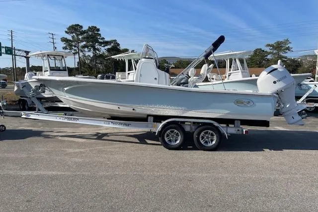 Slide: The Image of 2021 Sea Hunt BX 22 BR boat on trailer, parked outdoors. - 0