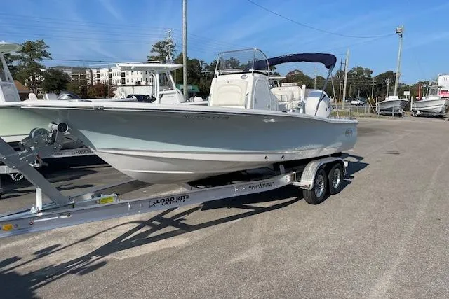 Slide: The Image of 2021 Sea Hunt BX 22 BR boat on trailer in parking lot, sunny day. - 1