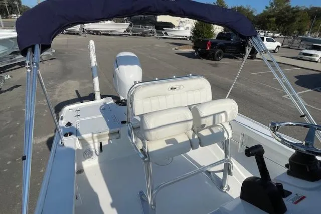 Slide: The Image of 2021 Sea Hunt BX 22 BR boat interior with seating and canopy. - 10
